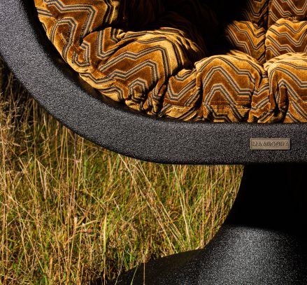 Handcrafted basalt design chair Bucifal by MAARCORA – sculptural form.