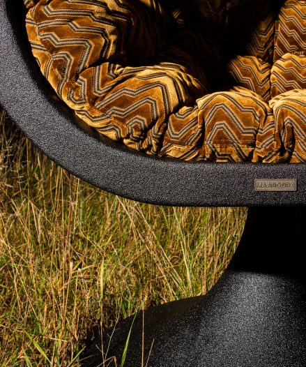 Handcrafted basalt design chair Bucifal by MAARCORA – sculptural form.