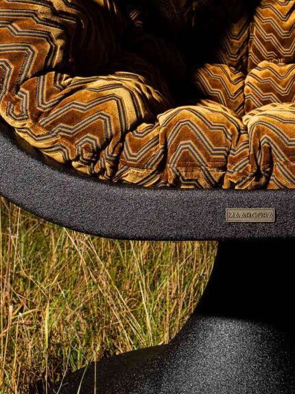 Maarcora Bucifal basalt sculptural chair, golden pillow.